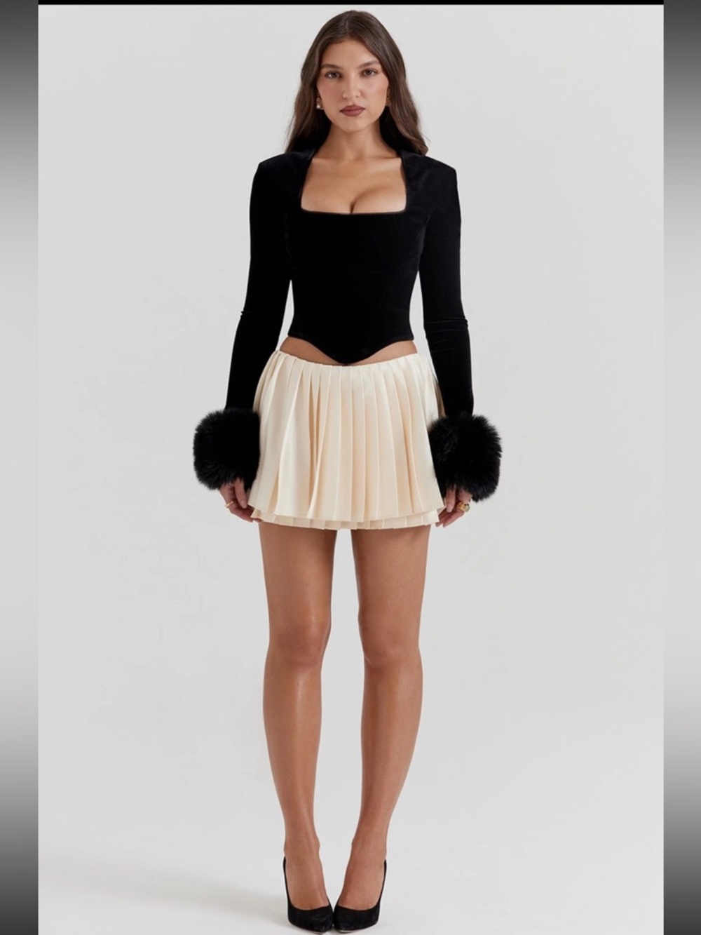 House of CB EMIRA
Ivory Pleated Mini Skirt